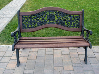 vintage wrought iron park bench in autumn