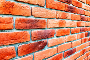 Weathered red brick wall as background