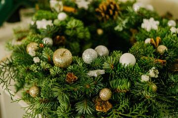 Christmas wreath with toys and cones
