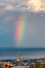 Naklejka na ściany i meble Vertical rainbow in the middle sea