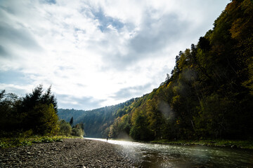 Mountain rapid river through the autumn forest