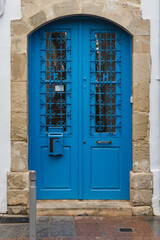Aged and stylish blueish wooden doors pattern