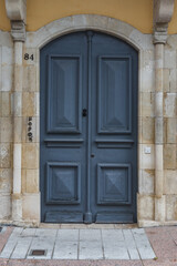 Aged and stylish blueish wooden doors pattern