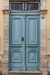 Aged and stylish blueish wooden doors pattern