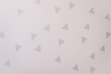 triangle wall stickers. white walls with decorations in a scandinavian style. interior details. copy space