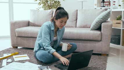 confident woman interior designer holding coffee is talking project over with partner online on...