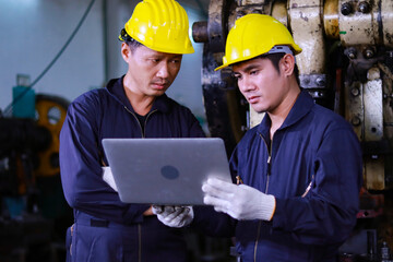 Young asian man Help each other check Machine working system