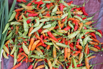 Red and green chili pepper sold in a food street market
