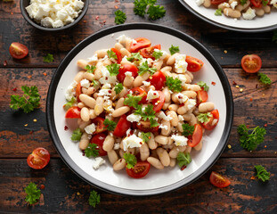 White Bean Salad with Cherry Tomatoes, Feta cheese and parsley. Healthy vegetarian, vegan food