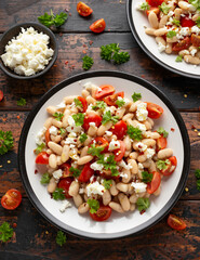 White Bean Salad with Cherry Tomatoes, Feta cheese and parsley. Healthy vegetarian, vegan food