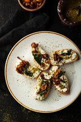 Bruschetta with cheese and mushrooms and  pasta pesto and basil