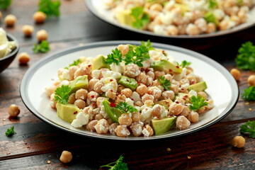 Chickpeas salad with feta cheese, avocado and herbs. healthy food