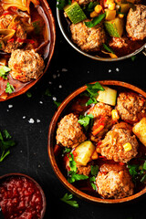 Tomato soup with meatballs, zucchini, corn in a plate