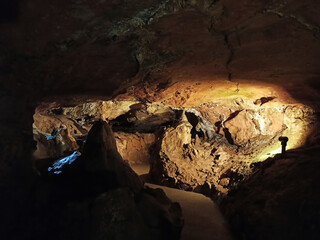 Journey. View inside a deep cave to the south. stalactites and stalagmites.