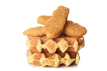 pile of belgian waffles and chicken tenders on white