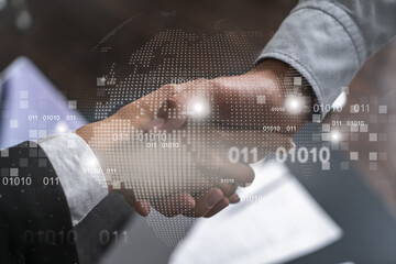 Double exposure of two businesspeople handshake and globe the earth hologram drawing background. Concept of international business. Formal wear.