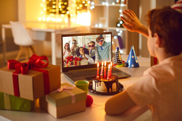 Birthday online. Children remotely wish their friend happy birthday using video call chat conference laptop - obrazy, fototapety, plakaty