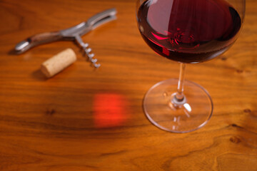 Glass of red wine on wood