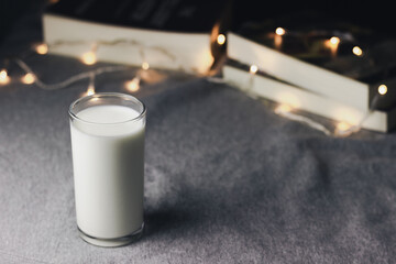 A glass of milk on table with bokeh background