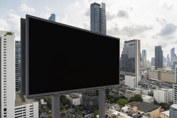 Obraz premium Blank black road billboard with Bangkok cityscape background at day time. Street advertising poster, mock up, 3D rendering. Side view. The concept of marketing communication to promote or sell idea.