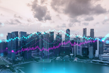 Glowing FOREX graph hologram, aerial panoramic cityscape of Singapore at sunset. Stock and bond...