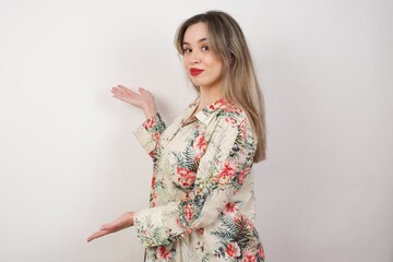 Young beautiful caucasian businesswoman over isolated background Inviting to enter smiling natural with open hands. Welcome sign.