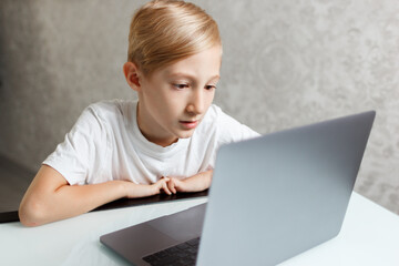 student at laptop doing homework online in quarantine