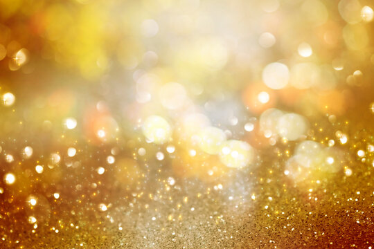 abstract defocused lights, sparkling holiday bokeh background with golden tones, elegant christmas backdrop