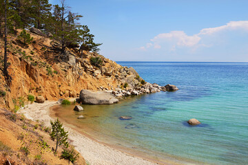 Baikal Lake on an summer day.  Calm clear water, Sandy Bay.