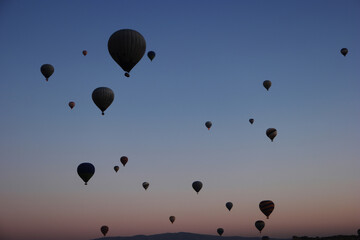 Hot air balloons on sunset sky. Beautiful nature background. Travel to Cappadocia.