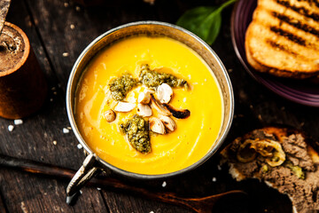 Pumpkin soup with cream with pesto and pate foie gras