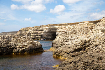 Caves along the sea. Beautiful seascape in summer.
