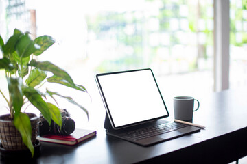 Desktop computer blank screen to insert pictures and text. On the table by the window