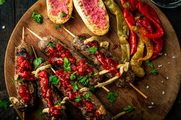 Grilled sausages and vegetables with  spices and fresh herbs