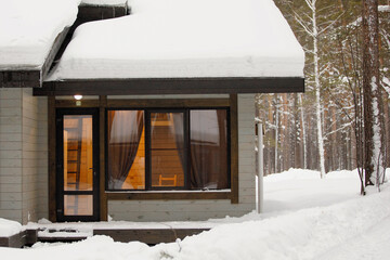 Snow-covered porch of a country house
