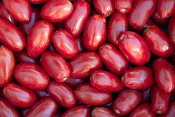 Red tomatoes background. Juicy and fresh tomatoes pattern.