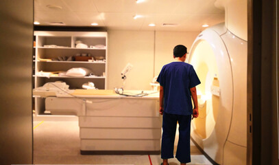 The technician checking mri scanner before scan patient in hospital daily.