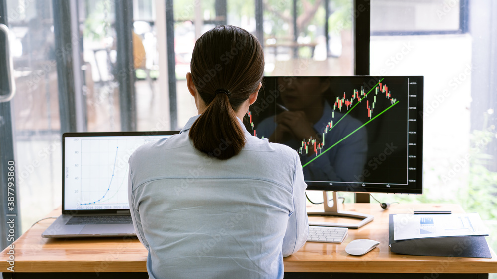 Aufkleber stock exchange trader working with graphs,diagrams on monitor in modern trading office