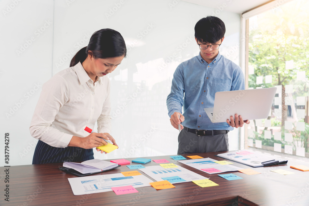 Poster businessman stick colorful notes to brainstorming on the table working on new project to share idea 