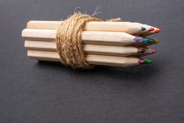 Bundle of colored pencils wrapped with linen string