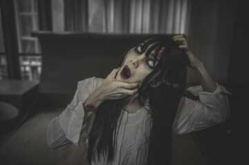 Portrait of asian woman make up ghost,Scary horror scene for background,Halloween festival...