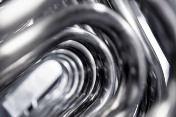 Abstract industrial background of metal pipes construction.