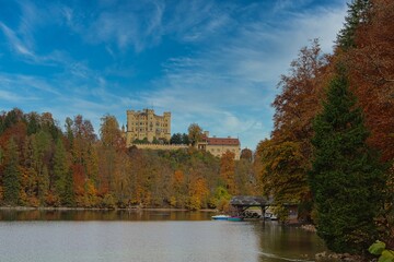 Fototapeta na wymiar Hohenschwangau castle surrounded by a beautiful autumn landscape