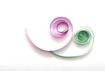 two origami paper quilling on white