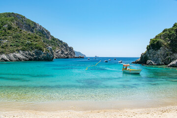 Fototapeta na wymiar The paradisal beach of Agios Spiridon in Paleokastritsa, Corfu, Greece