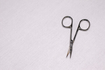 Nail scissors on a white background.