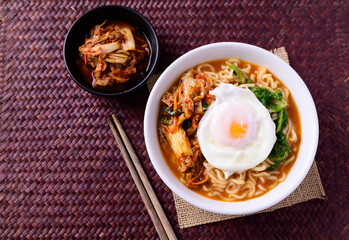 Korean food, Spicy noodles soup with kimchi and egg, Top view