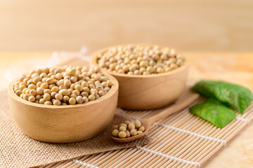 Soy beans in a bowl on wooden background
