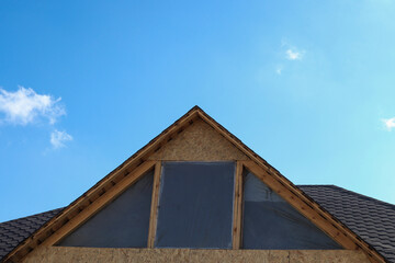 Work on the roof of the house, installation of Windows. Repair work, construction