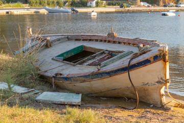 Afternoon in Kea (Tzia) island in Greece. Boat wreck by the sea. Other boats on the backgrownd,...